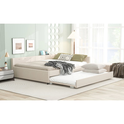 Grand lit tapissier beige avec ports et gigogne simple, structure en bois, aucun sommier requis, point focal de la décoration de chambre à coucher