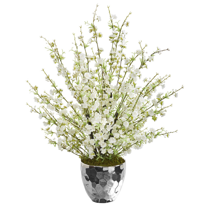 Arrangement floral de fleurs de cerisier artificiel dans un bol