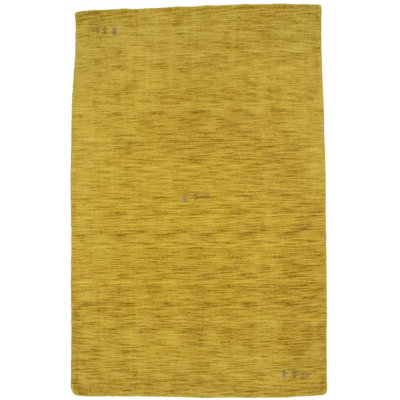 Tapis doré en laine tissé à la main