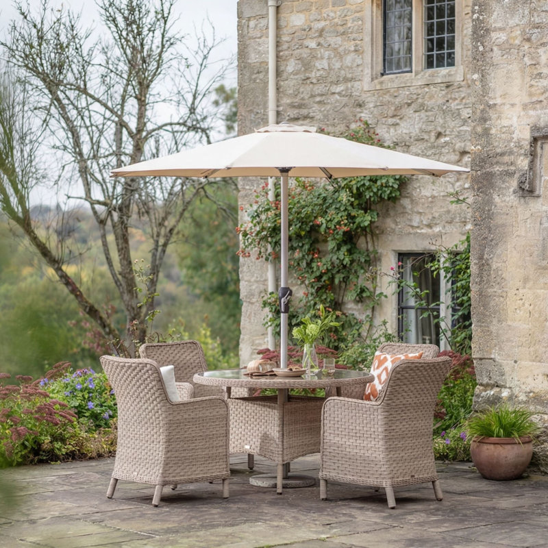 4 - Person Patio Dining Set with Round Table , Cushions Included