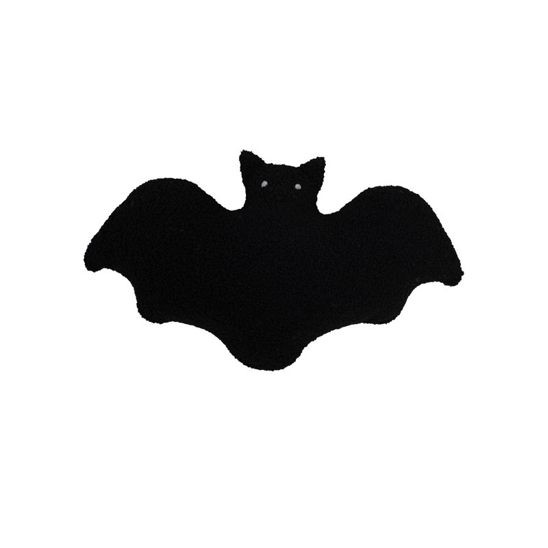 Coussin en forme de chauve-souris en faux sherpa
