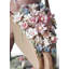 Figurine garçon brouette avec fleurs