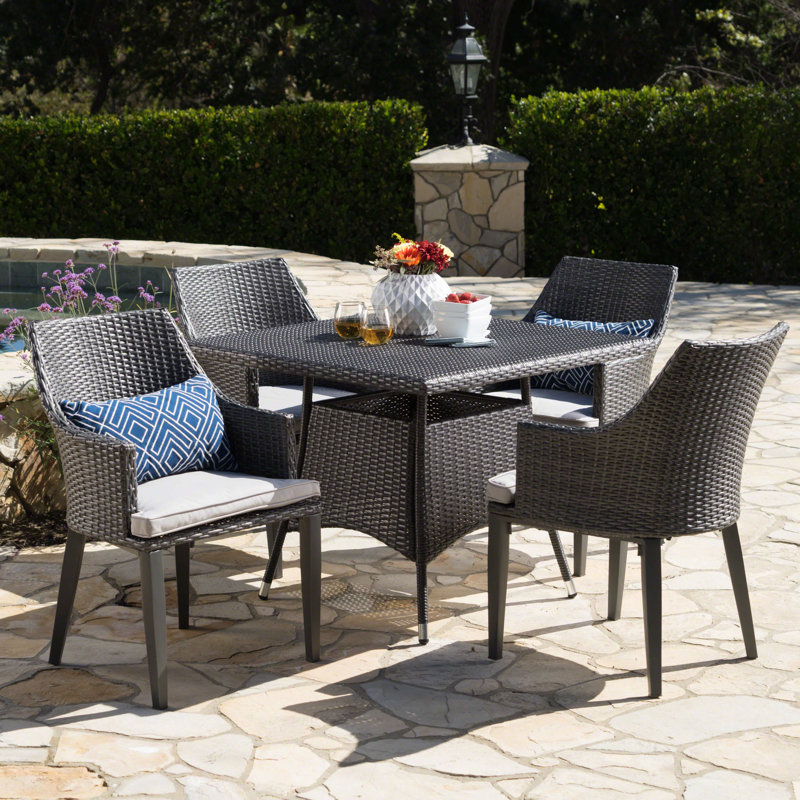 Backlund 4 - Person Wicker Patio Dining Set with Square Table , Cushions Included, Gray
