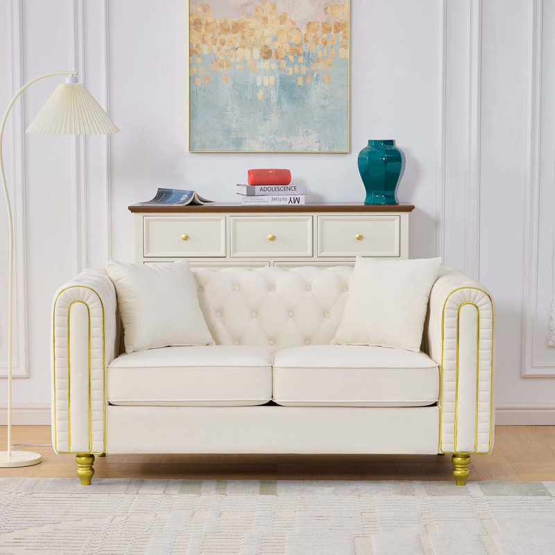 Causeuse Chesterfield en velours moelleux
