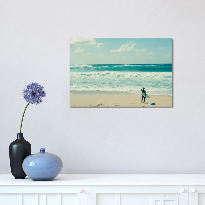Surfer Standing On The Beach, North Shore, Oahu, Hawaii, USA I by Panoramic Images - Wrapped Canvas Print