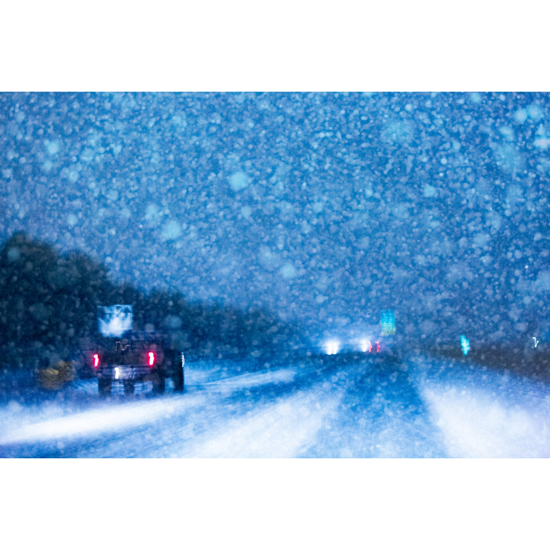 Traffic In A Snowstorm At Night von Debibishop - Kunstdrucke