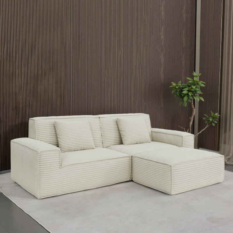 Canapé large en mousse de style moderne beige, parfait pour les salons et les chambres