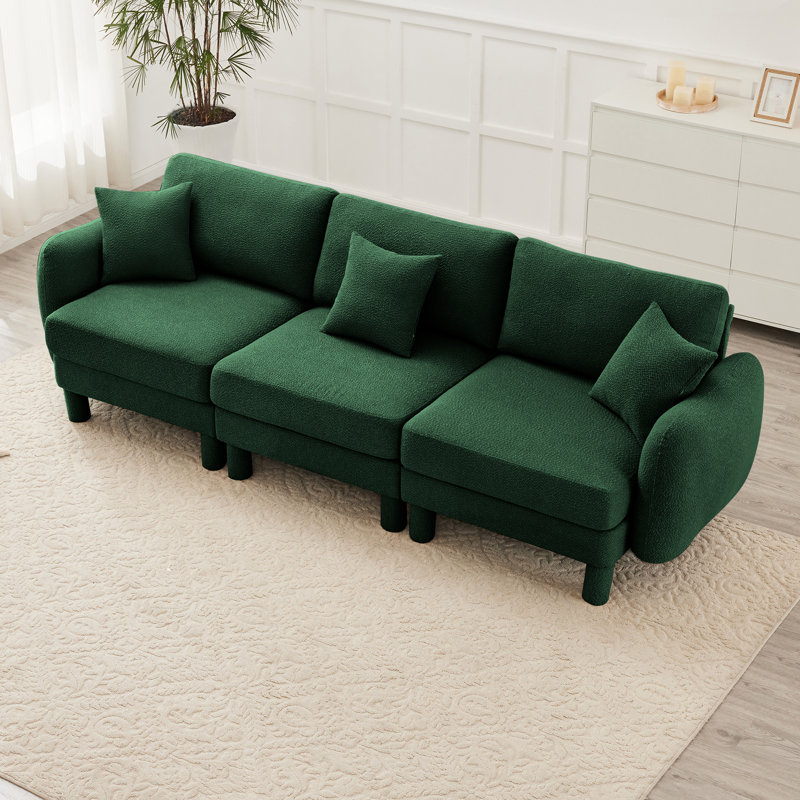 Canapé à trois places en tissu Boucle avec accoudoirs en forme de coquille distinctive et pieds cylindriques enveloppés de tissu, idéal pour divers espaces de vie