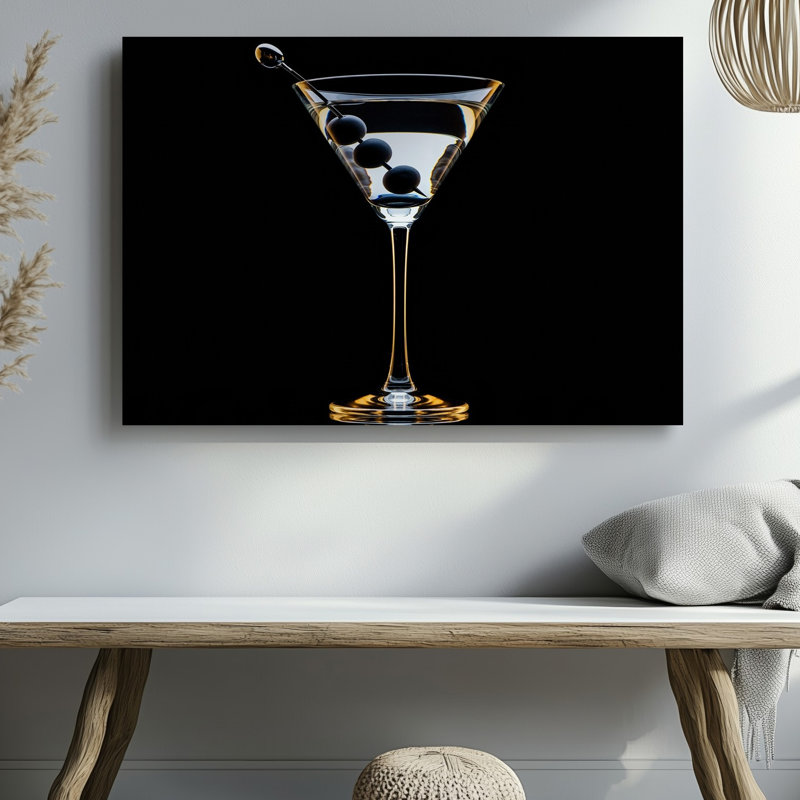 Canvas A Sleek Elegant Martini Glass Filled With Crystal Clear Liquid Wall Art Showcasing Three Dark Olives Skewered On A Silver Canvas Wall Art