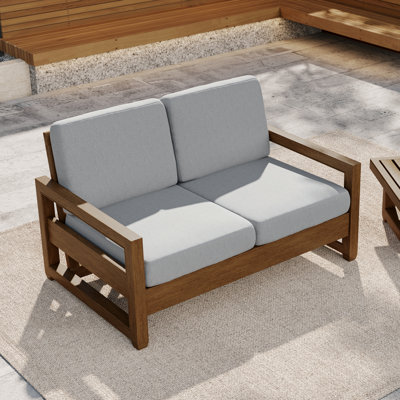 Causeuse d'extérieur en bois de teck massif Gustina avec coussin et accoudoirs