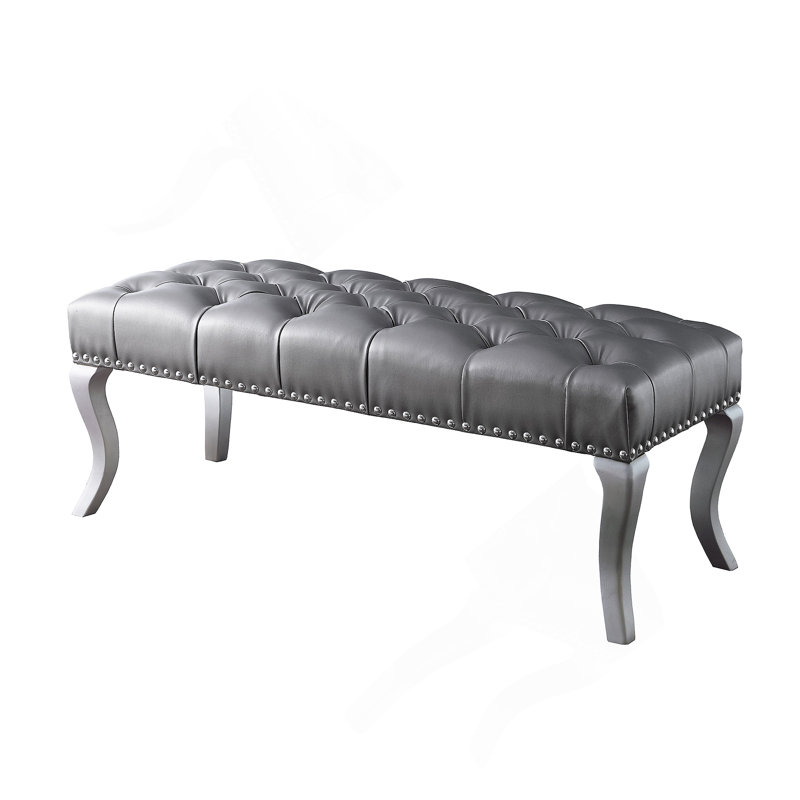 Banc capitonné en tissu avec garniture cloutée