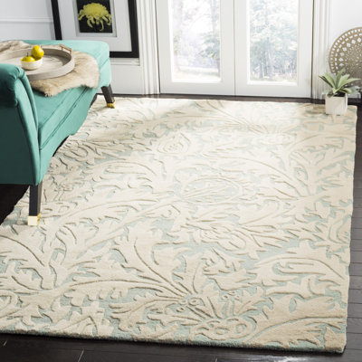 Tapis en laine / coton / latex touffeté à la main Candelo bleu clair / beige