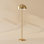 Lampe sur pied 2 lumières en laiton doré 58 po avec accents en rotin naturel Saluzzo
