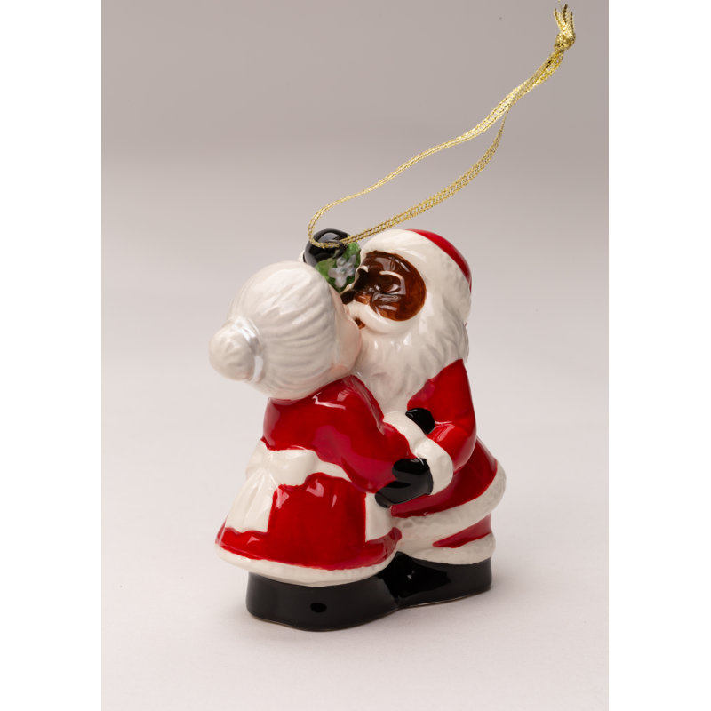Kissing Santa couple sel et poivre