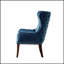 Fauteuil d'appoint à dossier capitonné, offrant une assise confortable et un design élégant, idéal pour les salons et les bureaux à domicile.