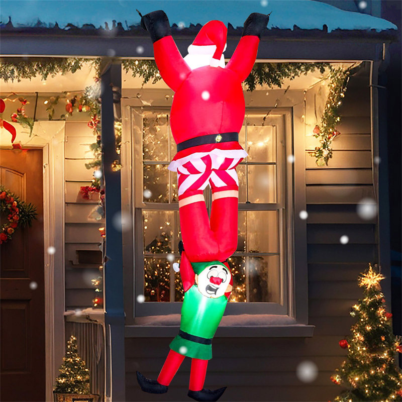 Climbing Santa with Falling Elf Inflatable Decoration