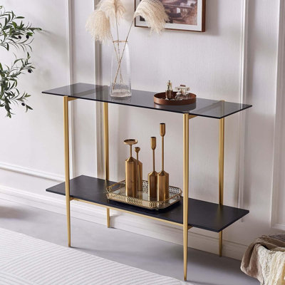 Console en verre pour le salon, le vestibule et l'entrée, canapé de style Mid-Century moderne à 2 niveaux avec plateau en verre gris, tablette en bois au fini marbre noir et structure au fini doré