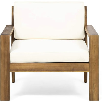 Fauteuil club crème avec base en bois massif et coussins crème épais