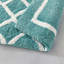 Tapis de bain réversible en microfibre touffetée à poils longs (un seul tapis)