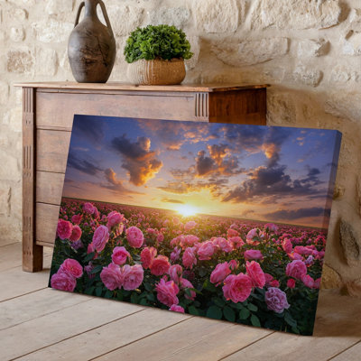 Canvas A Vibrant Field Of Blooming Pink Roses In The Foreground Wall Art Their Delicate Petals Glistening In The Warm Glow Of A Canvas Wall Art