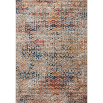 Tapis en polypropylène à motif de chevrons orange / bleu Mainville