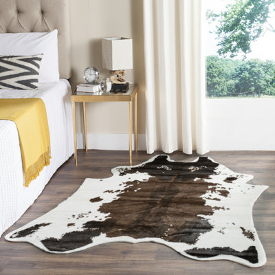 Gyula Hide Acrylic/Polyester Faux Cowhide Animal Print Rug in Brown