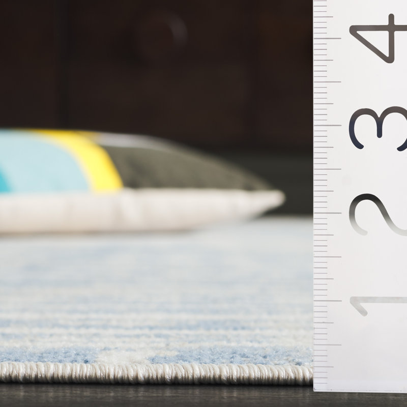 Ivory and Blue Abstract Synthetic Rectangular Area Rug