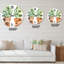 Deux plantes vertes dans des pots de fleurs orange - horloge murale traditionnelle-60327782