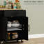 Chariot pour îlot de cuisine noir avec prises de courant et rangement pour ports, support pour micro-ondes, porte-serviettes et porte-épices, support