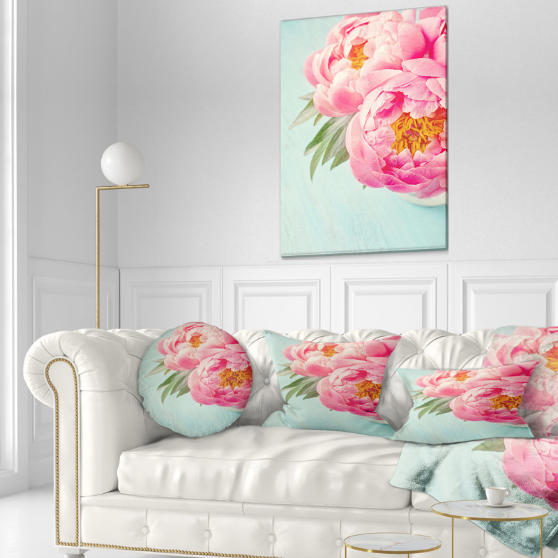 Coussin lombaire floral sur fond pivoine