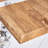 Natural Wood Grain MDF Dining Table - 55"X31.5" Stable Design.Suitable For Various Modern  Styles.Splicing Structure Design,Wood Textured Desktop,White Marble Patterned Table Legs.