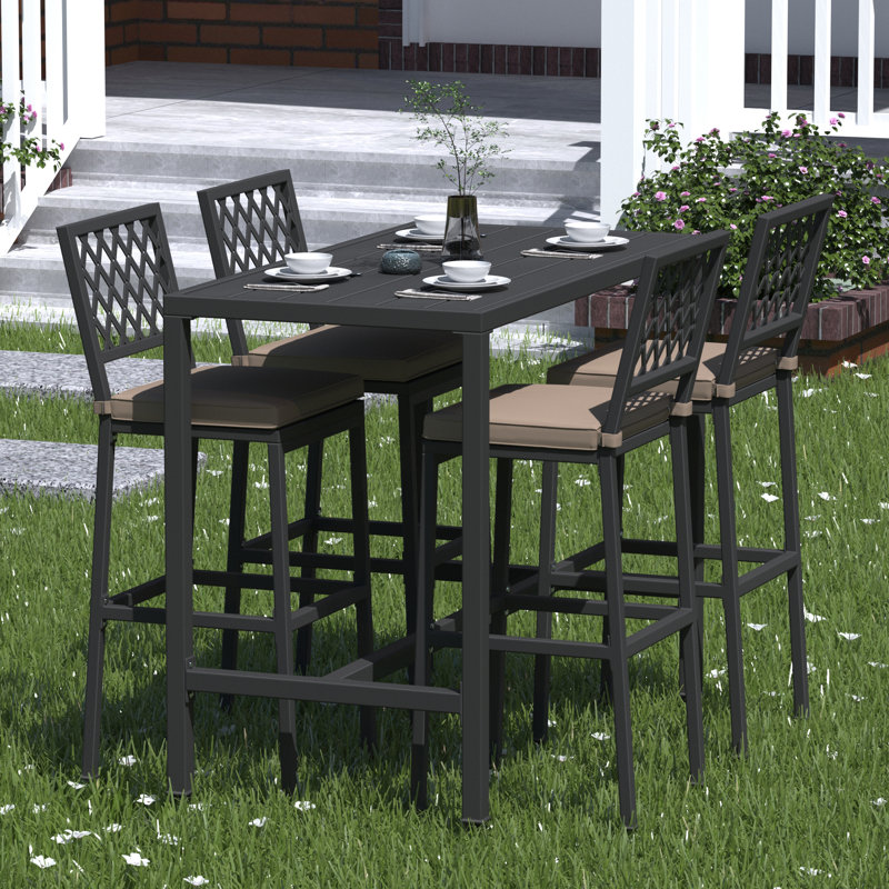 Hannatou 4 - Person Patio Dining Set with Rectangular Table , Cushions Included, Black
