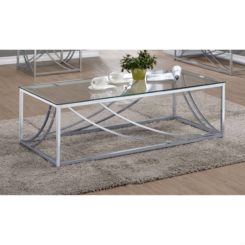 Table basse en verre et chrome avec pieds en métal