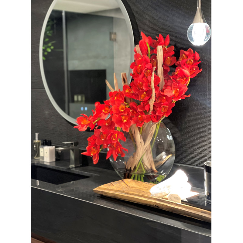 Red Cymbidiums And Driftwood In Glass Moon Vase