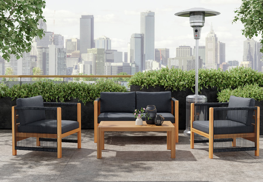 Commercial Patio Set with 1 sofa and 2 chairs that are gray with light wooden accents and a wooden coffee table. Image appears to be on a city restaurant's rooftop.