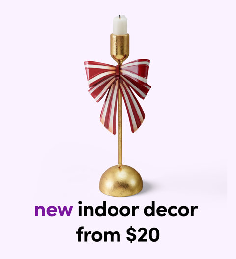 Gold candlestick with a red-and-white striped bow — new indoor decor from $20