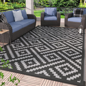 https://assets.wfcdn.com/im/78199444/resize-h300-w300%5Ecompr-r85/2365/236581334/Sumiye+Outdoor+Rug+for+Patio+Clearance%2C+Waterproof+Mat%2CReversible+Plastic+Camping+Rugs%2CBlack+%26+Gray.jpg