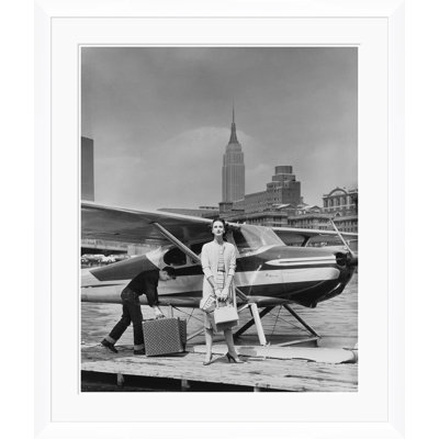 Vogue Magazine, "Woman by a Seaplane," John Rawlings, May 15, 1954 Framed Print