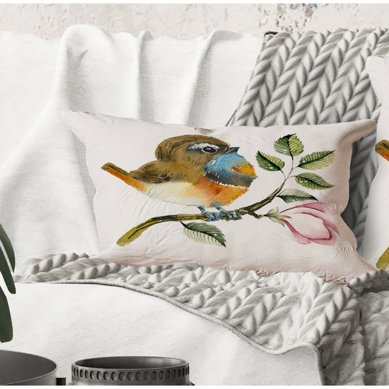 Coussin rectangulaire à motif d'oiseaux bleus sur une branche