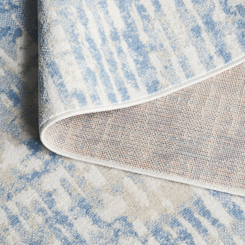 Ivory and Blue Abstract Synthetic Rectangular Area Rug