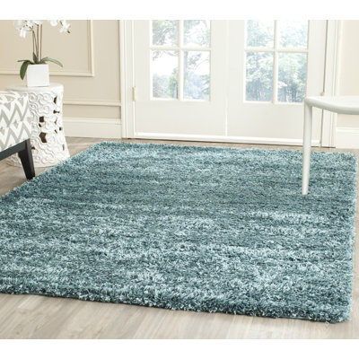 Tapis turquoise uni à longs poils Martelange
