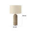 Lampe de table Rotta avec base sculptée, résine brune, abat-jour en lin beige-117054050