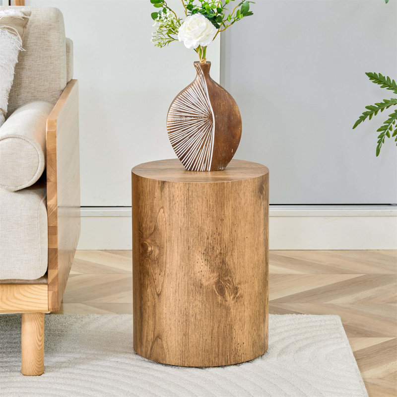 La table cylindrique avec sa conception à motif peut être facilement intégrée