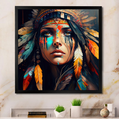 Multicolor portrait wall art of a woman in a traditional feathered headdress in a black frame.