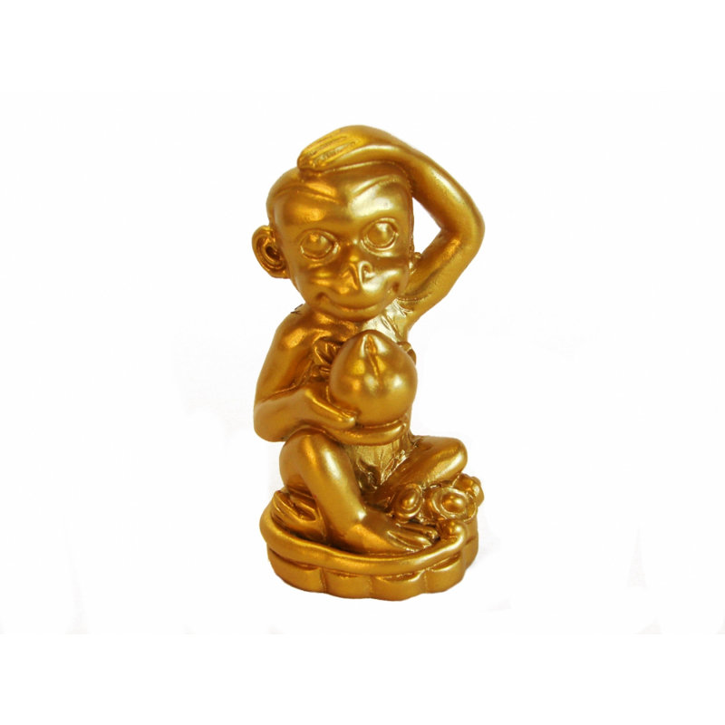 Figurine singe assis avec pêche pour une année de singe