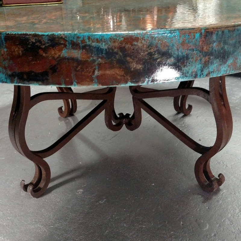 Luxurious Wrought Iron Coffee Table embellished with a 48” Round Oxidized Copper Top