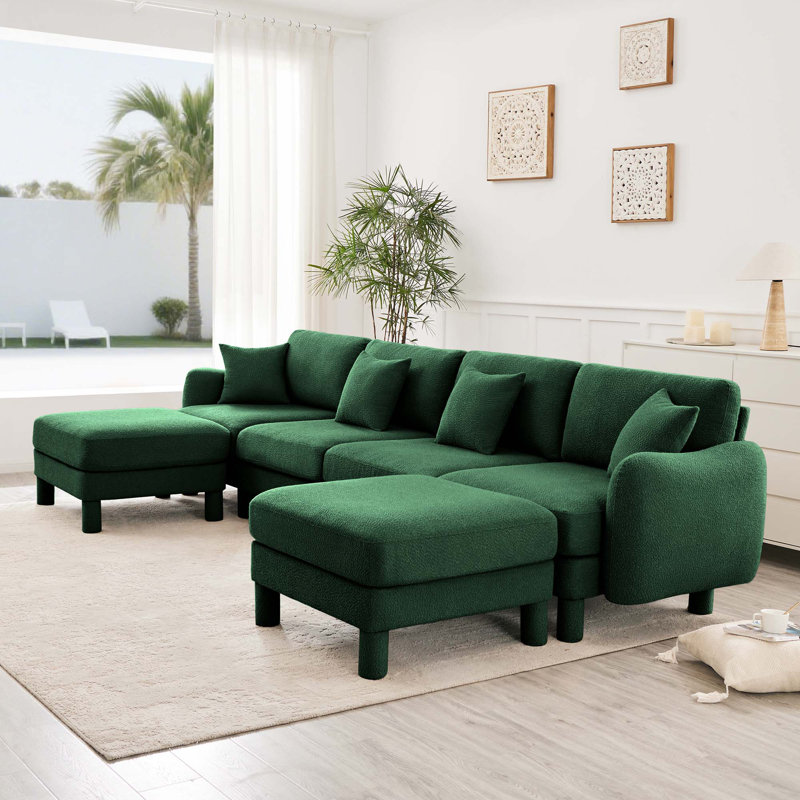 Canapé 4 places Boucle avec accoudoirs distinctifs en forme de coquillage, 2 repose-pieds amovibles et pieds cylindriques - enveloppé de tissu