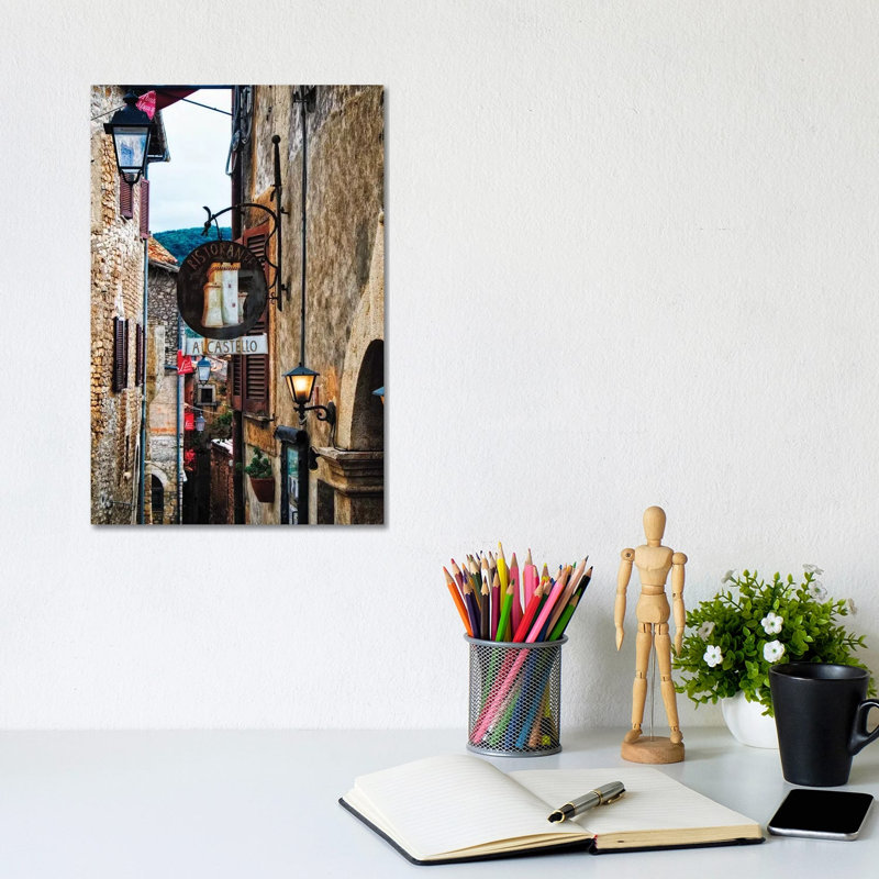 Medieval Street With Signs And Lamps, Sermoneta, Italy by George Oze - Wrapped Canvas Print, 20.32 cm H x 30.48 cm W