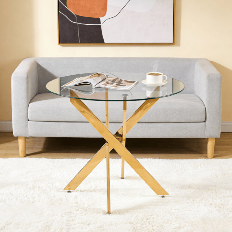 Table de salle à manger moderne à plateau en verre peu encombrant avec pieds en croix dorée - idéal pour la cuisine, le salon et les petits espaces