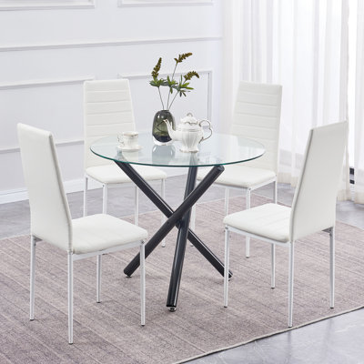 Ensemble de salle à manger pour 4 personnes, table de salle à manger ronde en verre Ebern Designs avec 3 pieds noirs et 4 chaises en cuir PU blanc